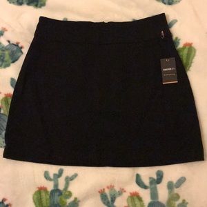 Black denim mini skirt